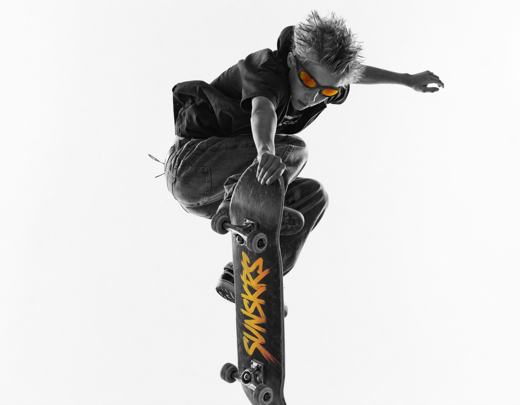 Skater mid-air wearing SUNSKRS Lightspeed with yellow lenses